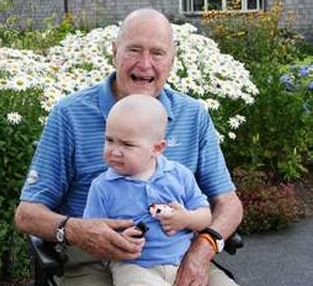 George H.W. Bush shaves head to encourage ailing child